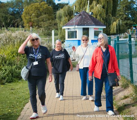 Two adult carers and imago staff enjoying a walk around Swanley Park. Photograph taken by Steve Eckhardt